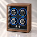 Coffret 4 montres en bois, porte vitrée fermée, commandes chromées en façade, berceaux éclairés en bleu.