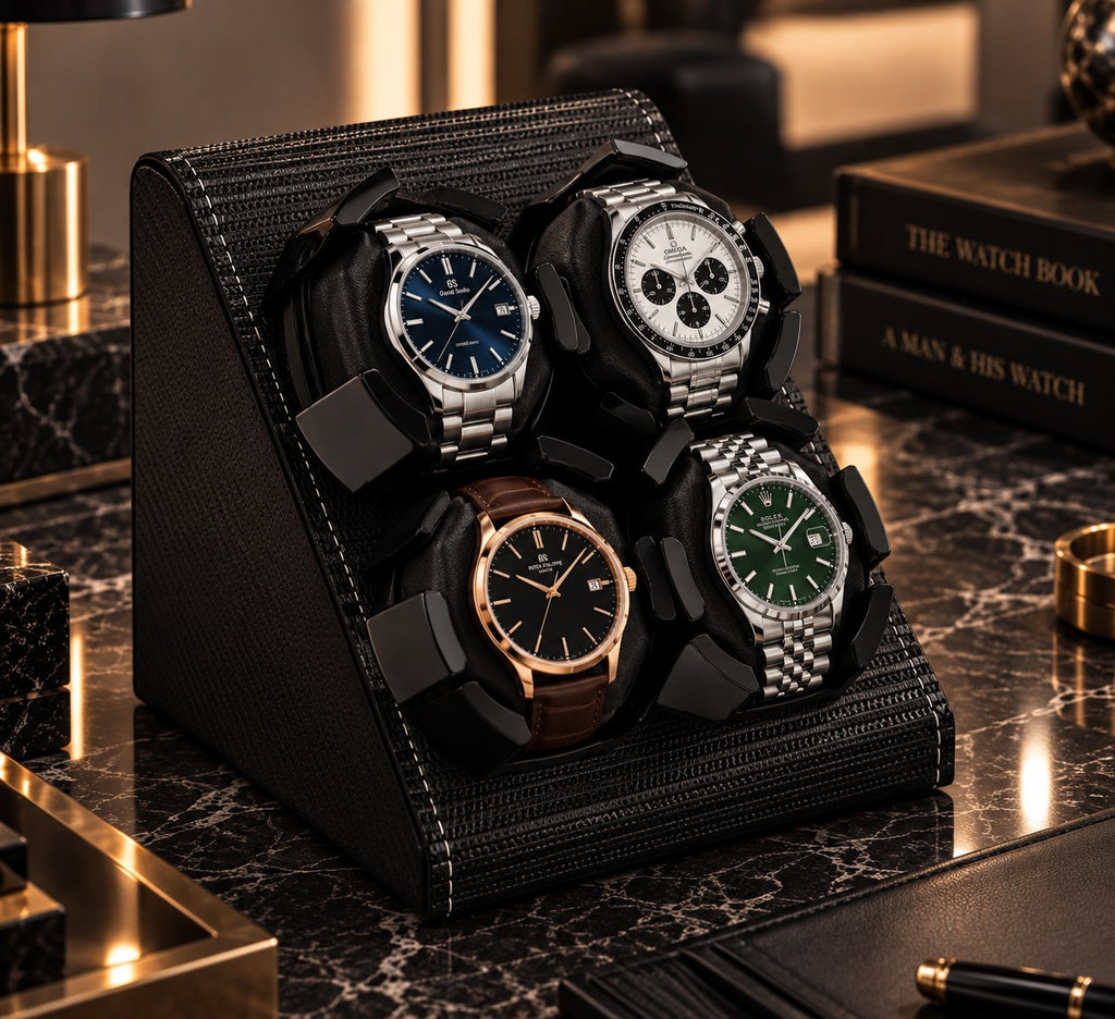 Vu de trois quarts sur une étagère en marbre, quatre montres dans leurs berceaux